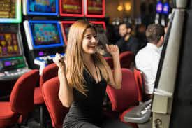 Live dealer dealing cards in Habanero baccarat studio